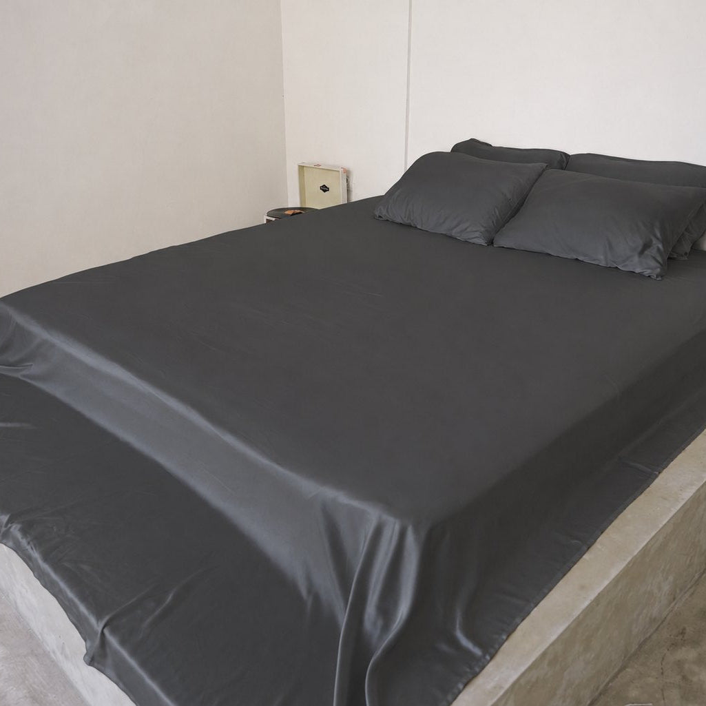 Charcoal Whisper bamboo sheet set on a queen bed