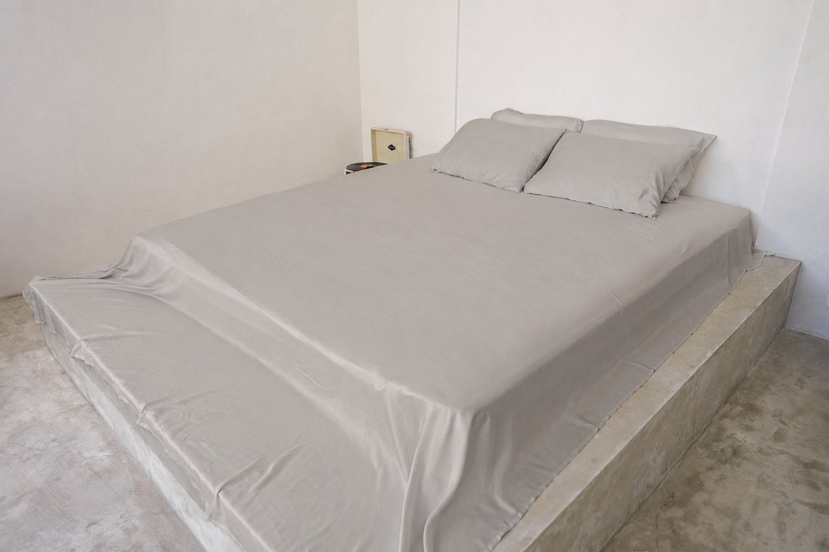 Misty Dove Gray bamboo sheet set on a queen bed