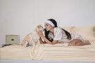 Woman kissing her dog on Champagne Silk bamboo sheets (colour visualisation)