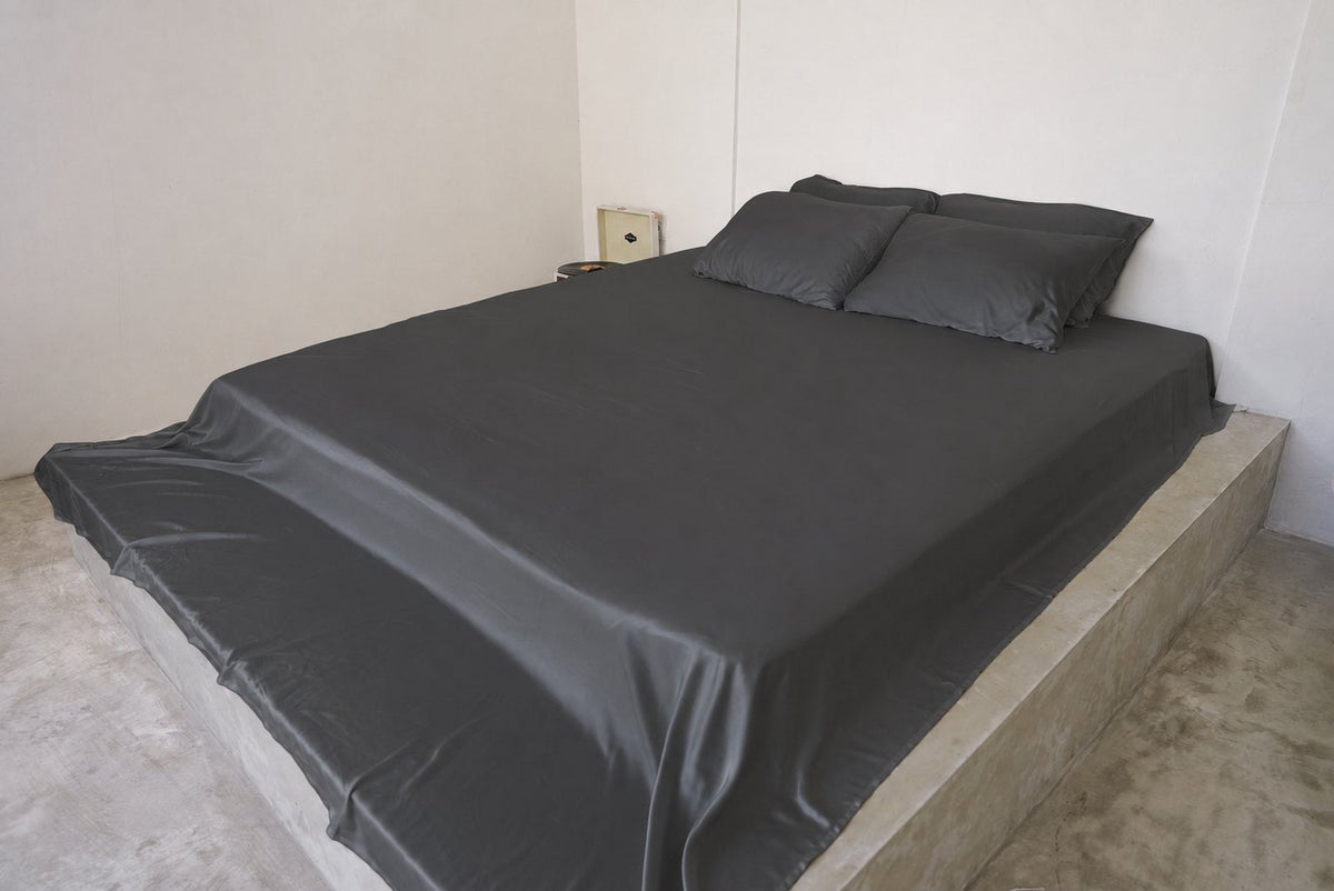 Charcoal Whisper bamboo sheet set on a queen bed